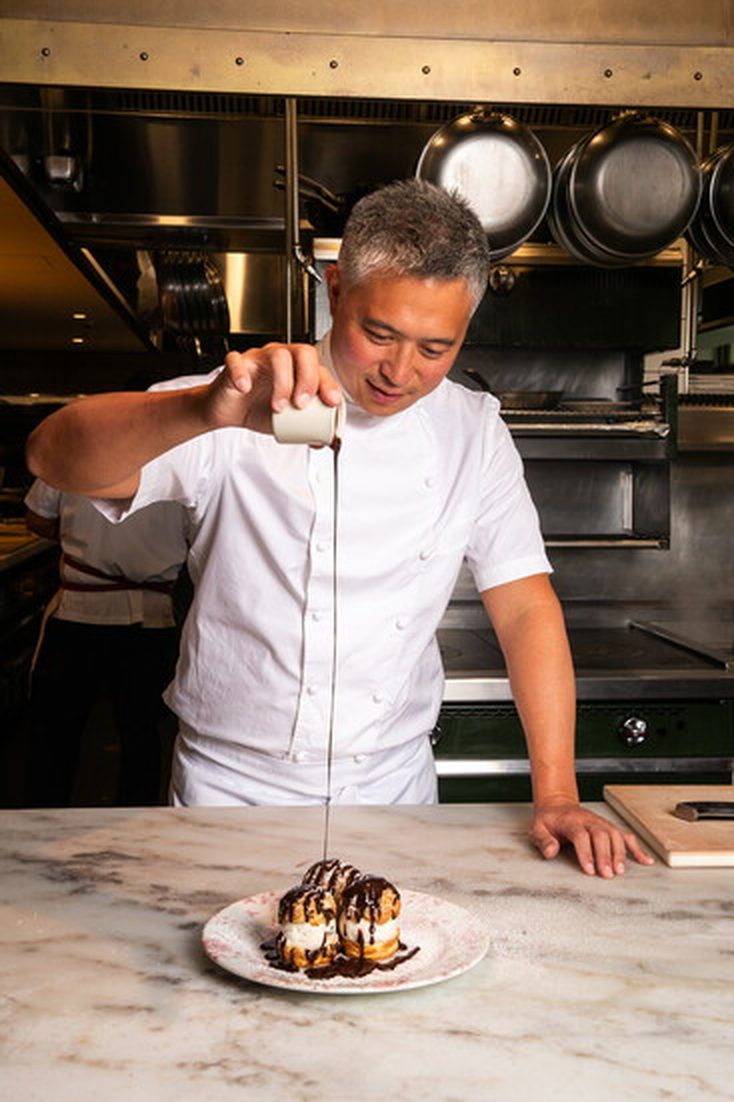 Chef Jason Hua plating a dessert